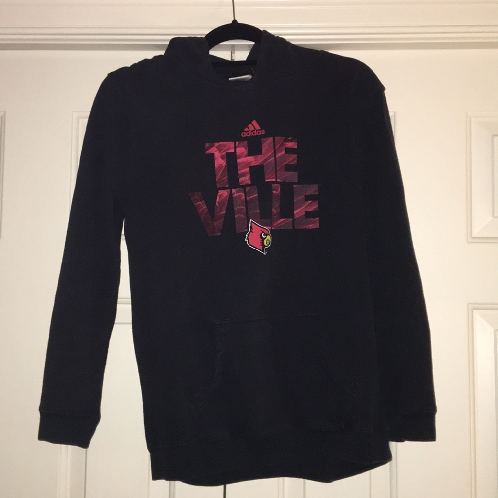 University of Louisville sweatshirt.